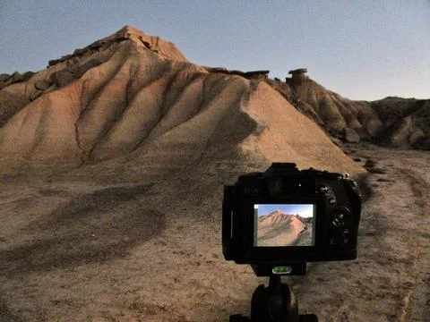 Camera Capturing Desert Badlands at Dusk on a Tripod - Photographer's persp.. Stock Photos