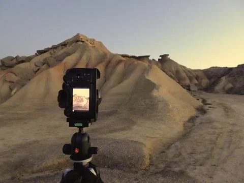 Camera Capturing Desert Badlands at Dusk on a Tripod - Photographer's persp.. Stock Photos