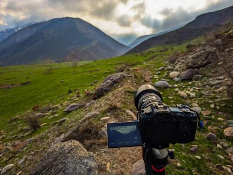 Camera capturing serene landscape in mountainous region Stock Photos