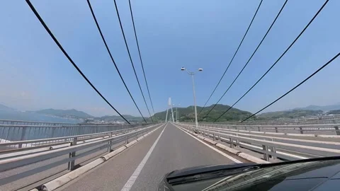 Camera car, a black car passing on the Seto Bridge, Japan, on a beautiful s.. Stock Footage 240517502