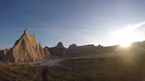 Camera in car drives by rock formations in the Badlands Stock Footage 81764007