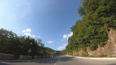 Camera car front pov driving on panoramic road by Meteora rock mountains near Vídeo Stock 147120067