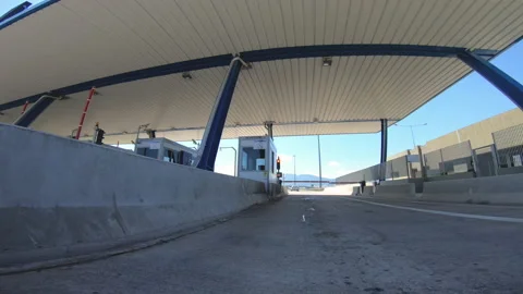 Camera car front pov driving through highway tollbooth Stock-Footage 237455796
