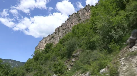 Camera car on road close to a tall mountain in northern Italy Stock-Footage 36971593