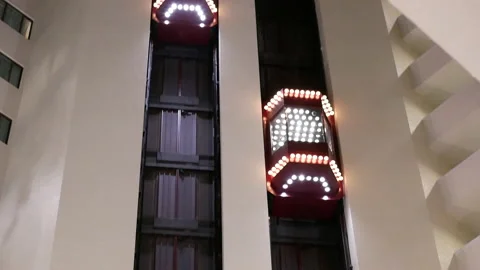 Camera chasing of people taking elevator inside the shopping mall Video stock 102593911