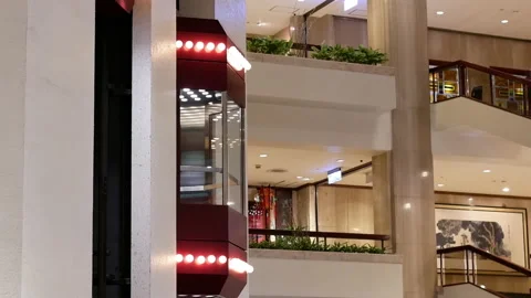 Camera chasing of people taking elevator inside the shopping mall Video stock 103065569