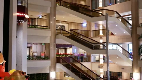 Camera chasing of people taking elevator inside the shopping mall Video stock 103084171