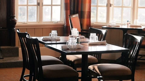 Camera circles around restaurant table at sunrise Stock-Footage 102670294