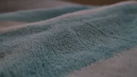 Camera up close moving through soft comfy fabric towels Stock Footage 76451806
