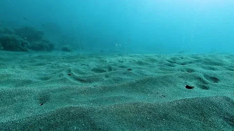Camera close to sand with vulcanic  bubble raising Stock Footage 338361675