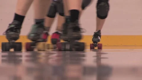 Camera close-up of skaters on glossy track, Texas Roller Derby Video stock 232957573