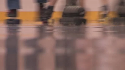Camera close-up of skaters with great reflection on track, Texas Roller Derby Video stock 232957572