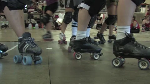 Camera close-up of various skaters training on bank track, Texas Roller Derby Video stock 232957751