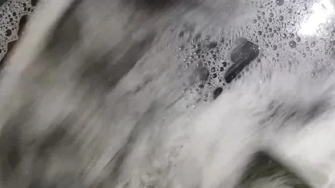 The camera closely watches how the laundry rotates in different directions in Stock Footage 150312713