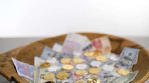 Camera comes closer to the banknotes and coins Stock-Footage 125776124