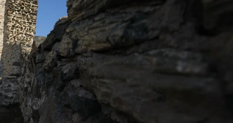 Camera crane shot from stone wall to stone medieval tower Видео 118537892