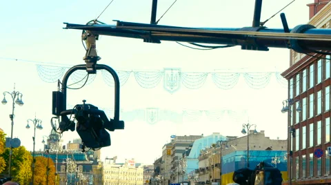 Camera crane with a television camera moves from left to right Stock Footage 66879345