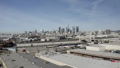 Camera cranes down over warehouse district east of downtown Los Angeles Video stock 101855679