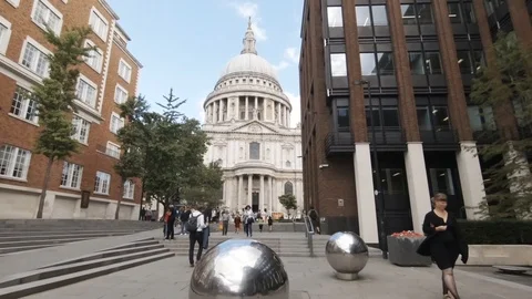 Camera cranes down from St Paul's Cathedral to silver spheres Stock Footage 93857931