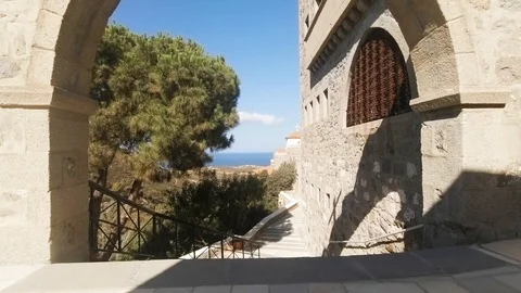 Camera cranes down from a stone cross to reveal a scenic view in Nunnery 動画素材 92086637