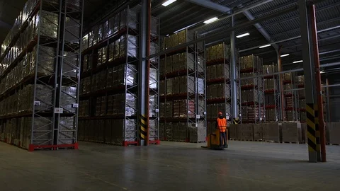 Camera cranes up on shelves of cardboard boxes inside a storage warehouse. 스톡 동영상 87127818