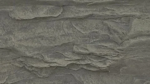 The camera crawls up the rock for a long time and shows the surface texture. Stock Footage 147507597