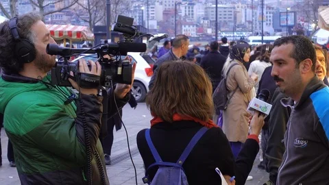 Camera crew on the fish market. The correspondent interviews the seller. Stock Footage 87920095