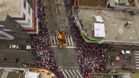 Camera Descends over a Carnival Float during Parade in Ambato Stock Footage 73037599