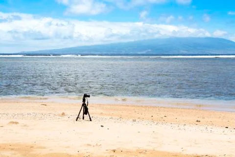 Camera on deserted beach Stock Photos