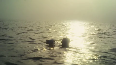 Camera Diver in the Ocean in Waterproof suit Stock Footage 279423520