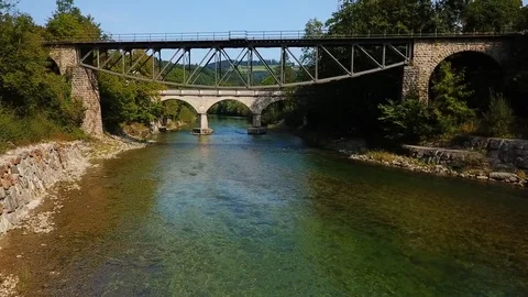 Camera dives under a bridge and rises over another Stock Footage 108731476