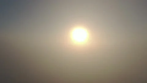 Camera diving downward into tick mist towards the sun Stock Footage 144146576