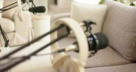 Camera doing shallow focus shift, drawing mic and headphones into sharp focus Stock Footage 335000287