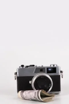 Camera with a dollar, model on dollar banknote Stock Photos