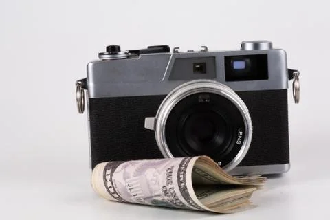 Camera with a dollar, model on dollar banknote Stock Photos