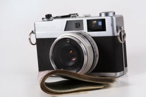 Camera with a dollar Stock Photos