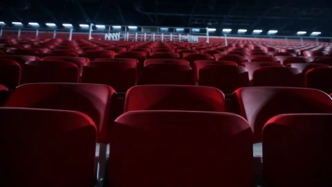 Camera dollies out to reveal empty seats in a basketball Stock Footage 79100258