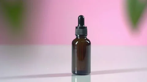 Camera dolly in focus brown bottle serum Stock Footage 167659496