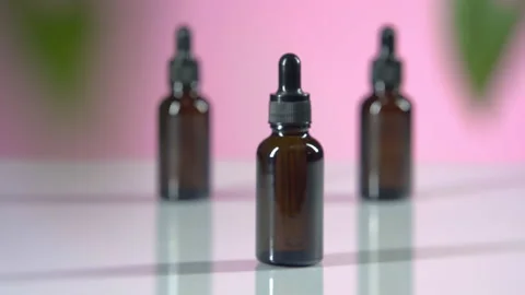Camera dolly in focus brown bottle serum Stock Footage 167659555