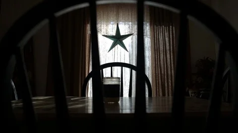 Camera dolly forward, past the rails of chair towards moody dining room table Stock Footage 98366430