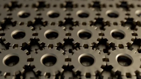The camera dolly-in, plunging through stacked, interlocking steel cogs. Stock Footage 329399563