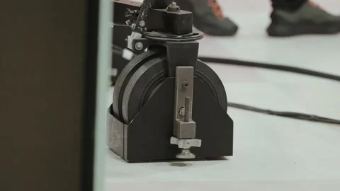 Camera dolly wheel and track base inside production studio Stock Footage 328928922