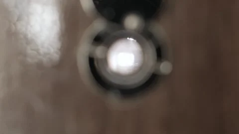 Camera dolly zoom peeks through peephole 動画素材 276208234