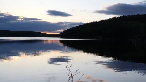 Camera down to top over sunset lake view Stock Footage