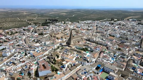 A camera drone flies ahead over Bujalance, Andalusia Stock Footage 202600450