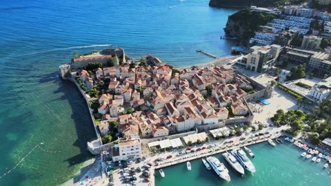 A camera drone flies around Budva Old Town Stock Footage 249419560