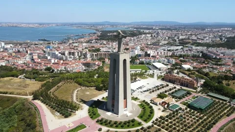 A camera drone flies around the Sanctuary of Christ the King in Lisbon Stock Footage 202015771