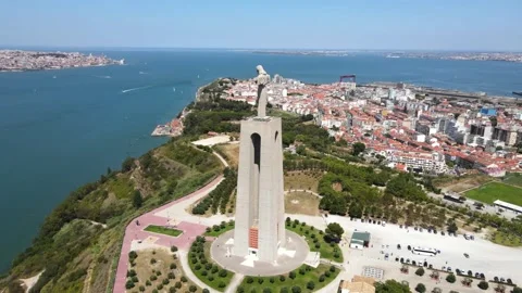 A camera drone flies around the Sanctuary of Christ the King in Lisbon Stock Footage 202016099