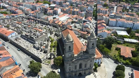 A camera drone flies backward over the Church of Our Lady of Lapa Stock Footage 202060656