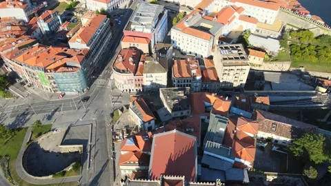 A camera drone flies backward over Porto Cathedral Stock Footage 202061464